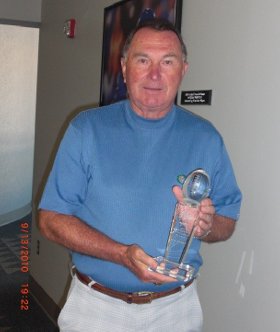 Rich Brooks with the Blanton Collier award trophy Rich Brooks with the Blanton Collier award trophy